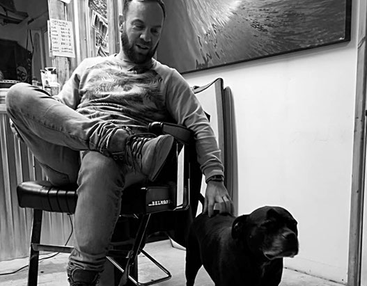 Bruno, cutting hair on the seaside in Porthleven, Cornwall